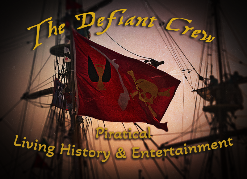 The pirate flag attributed to Christopher Moody, a red standard with a winged hourglass, an arm bearing a dagger and a golden skull and crossed bones with text superimposed reading The Defiant Crew, piratical living history & entertainment
